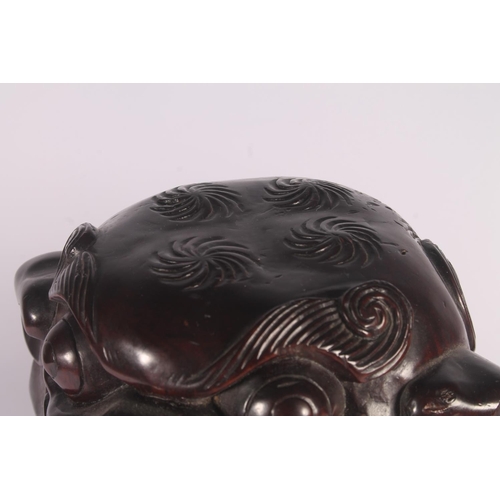 17 - Chinese carved hardwood Qilin or Foo Dog figure, 36cm high.