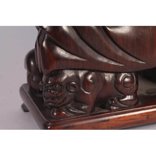 17 - Chinese carved hardwood Qilin or Foo Dog figure, 36cm high.