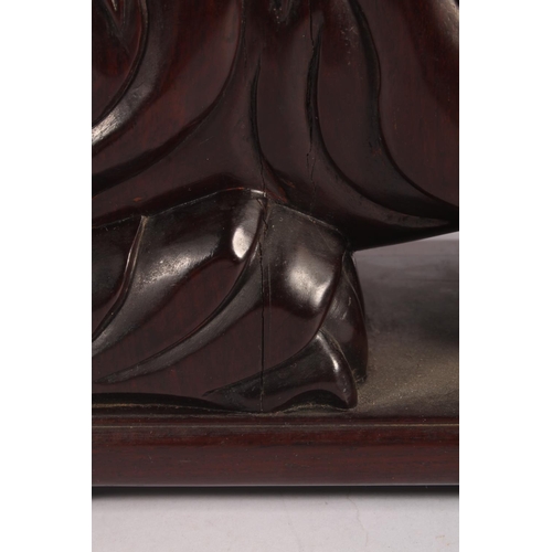 17 - Chinese carved hardwood Qilin or Foo Dog figure, 36cm high.