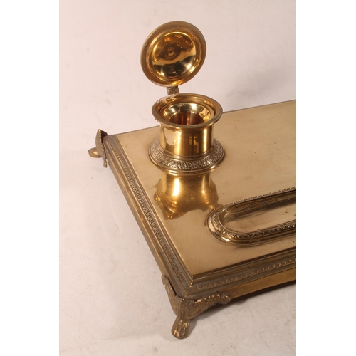 1 - Brass pen stand with two integral ink stands, 32cm wide.