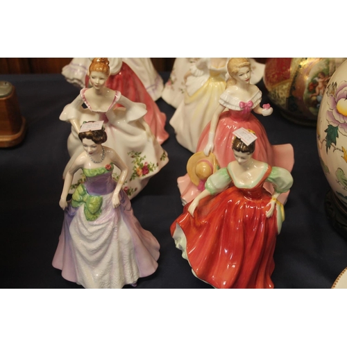 24 - Eight Royal Doulton figures.