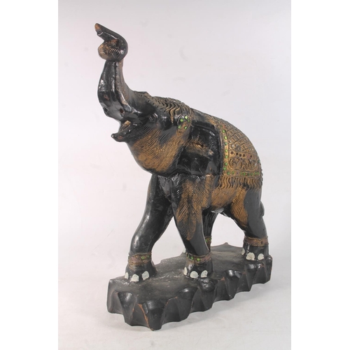 33 - Ebonised and gilt model of an Indian elephant, 44cm high.