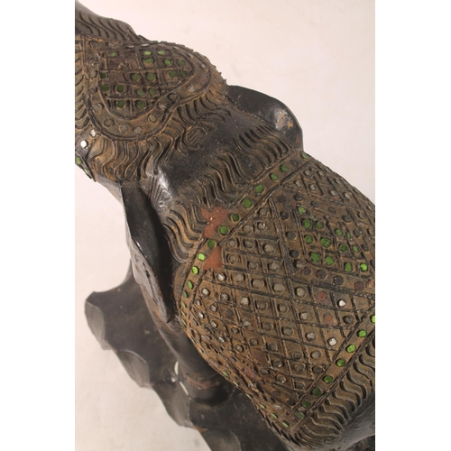 33 - Ebonised and gilt model of an Indian elephant, 44cm high.