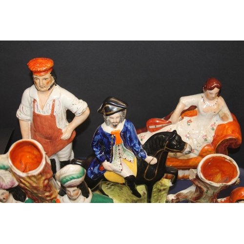 43 - Nine Staffordshire flatback figurines.