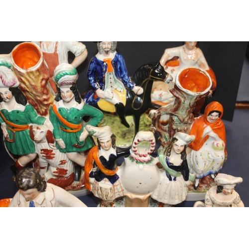 43 - Nine Staffordshire flatback figurines.