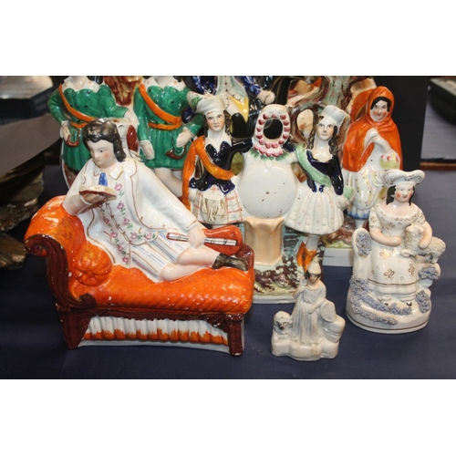 43 - Nine Staffordshire flatback figurines.