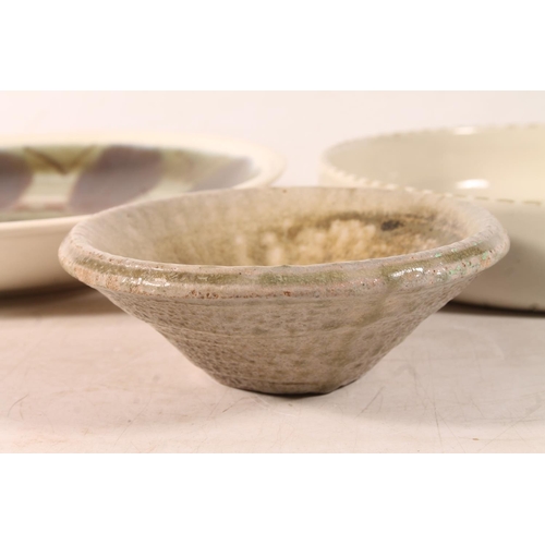 59 - Studio Pottery plate and two Studio Pottery bowls, largest 25cm diameter.