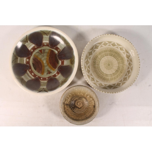 59 - Studio Pottery plate and two Studio Pottery bowls, largest 25cm diameter.
