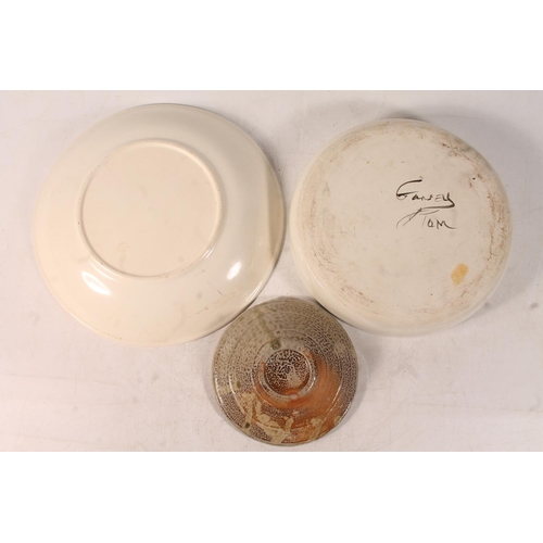 59 - Studio Pottery plate and two Studio Pottery bowls, largest 25cm diameter.