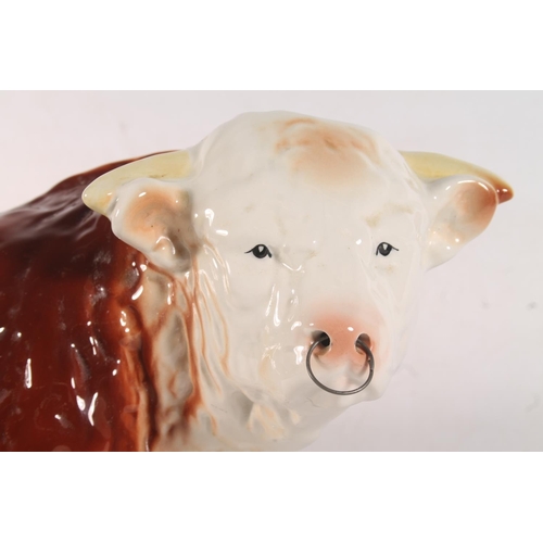 6 - Melba ware pottery bull model, 40cm long.