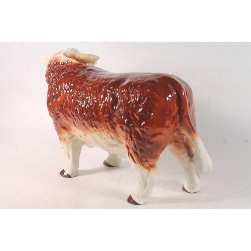 6 - Melba ware pottery bull model, 40cm long.