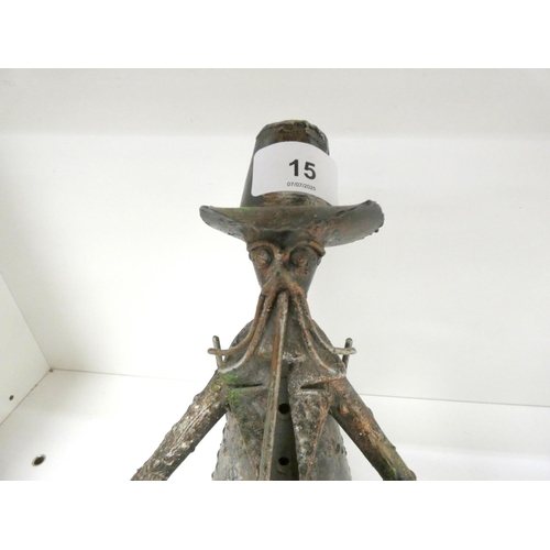 15 - 1920's Italian metal sculpture of a seated man, unsigned, 32cm.