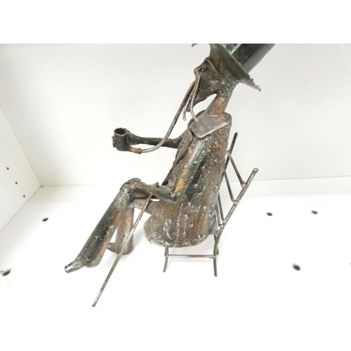 15 - 1920's Italian metal sculpture of a seated man, unsigned, 32cm.
