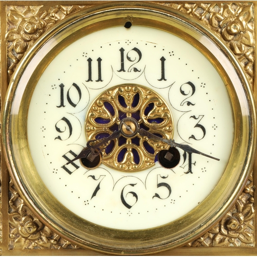 50 - Antique square brass mantel clock, classical ornamentation with putti sat atop and faces on all side... 