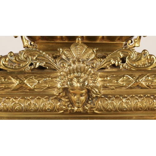 50 - Antique square brass mantel clock, classical ornamentation with putti sat atop and faces on all side... 