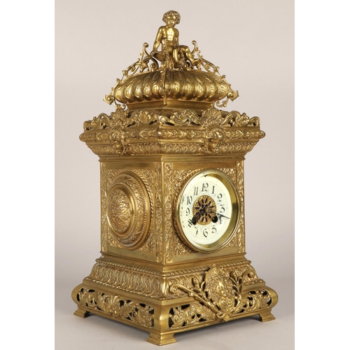 50 - Antique square brass mantel clock, classical ornamentation with putti sat atop and faces on all side... 