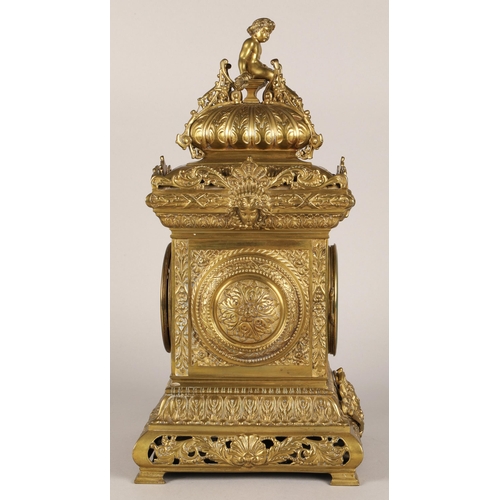 50 - Antique square brass mantel clock, classical ornamentation with putti sat atop and faces on all side... 