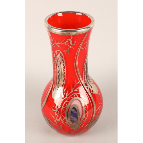 41 - Double layered glass vase with white metal overlay, stands 35cm