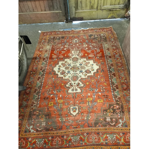 Red ground multi border fringed rug with floral and geometric design ...