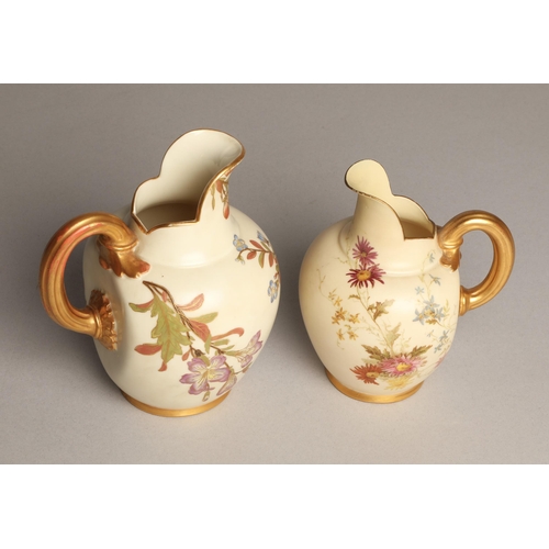 23 - Royal Worcester two graduated blush ware jugs, tallest stands 16cm.