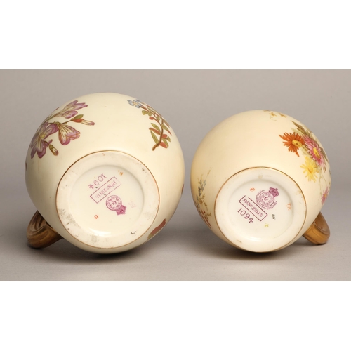 23 - Royal Worcester two graduated blush ware jugs, tallest stands 16cm.