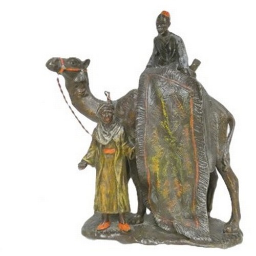 Cold painted spelter Arabian themed lighter in the form of a man on a camel in the manner of Franz Bergman.