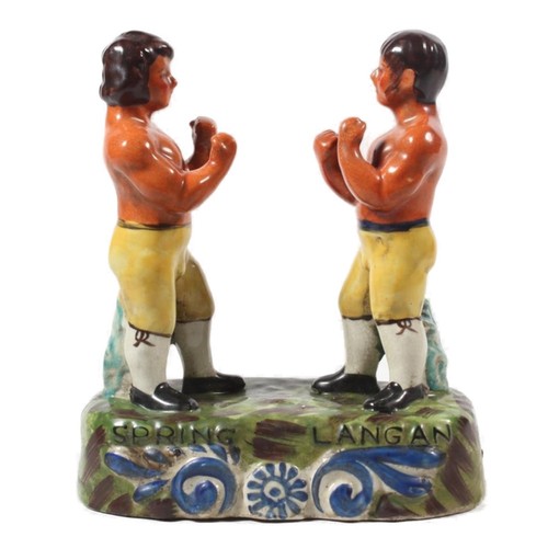 Reproduction Staffordshire style pottery figurine of pugilists Spring and Langan, 21cm high.