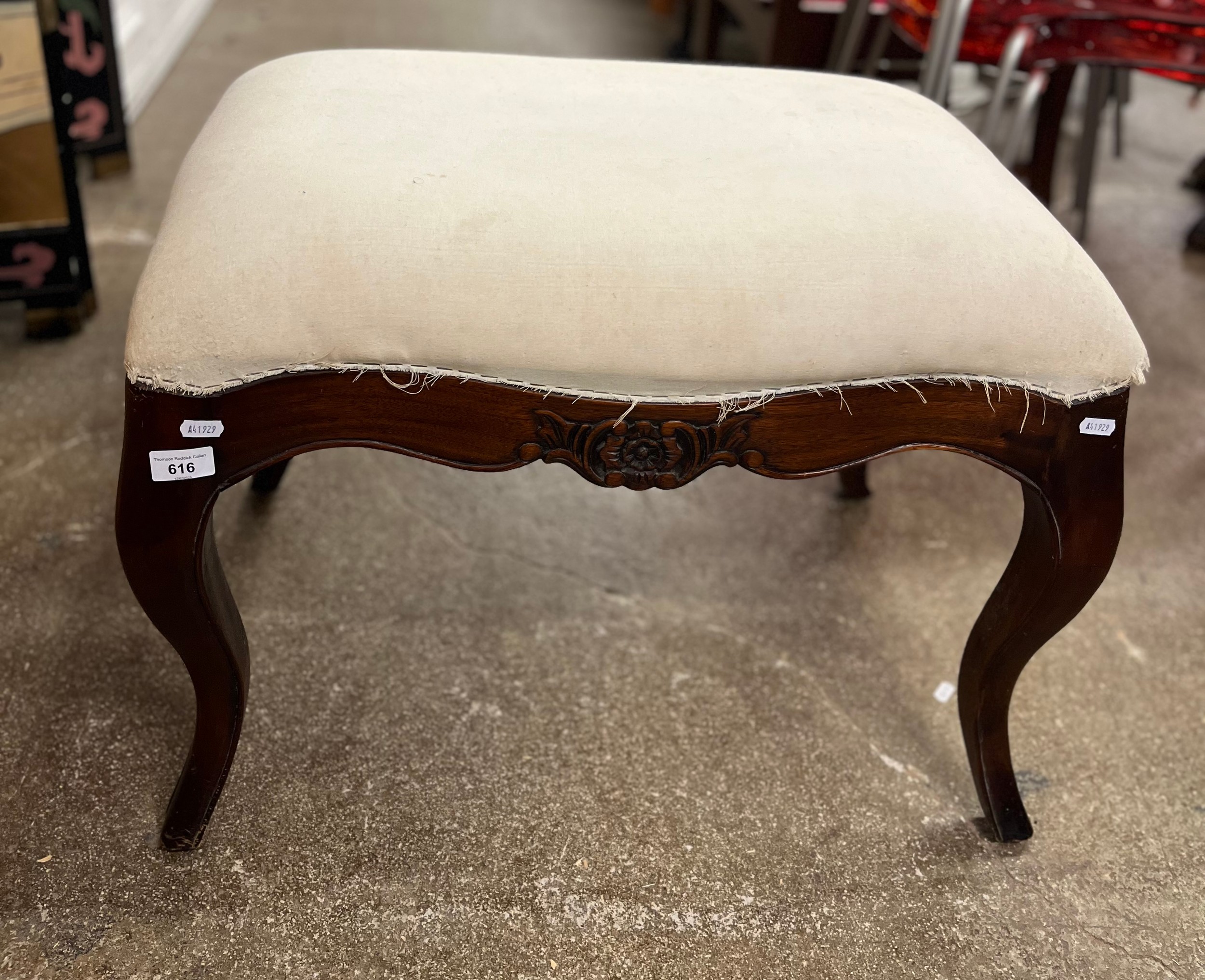 Mahogany rectangular upholstered stool on carved cabriole supports.