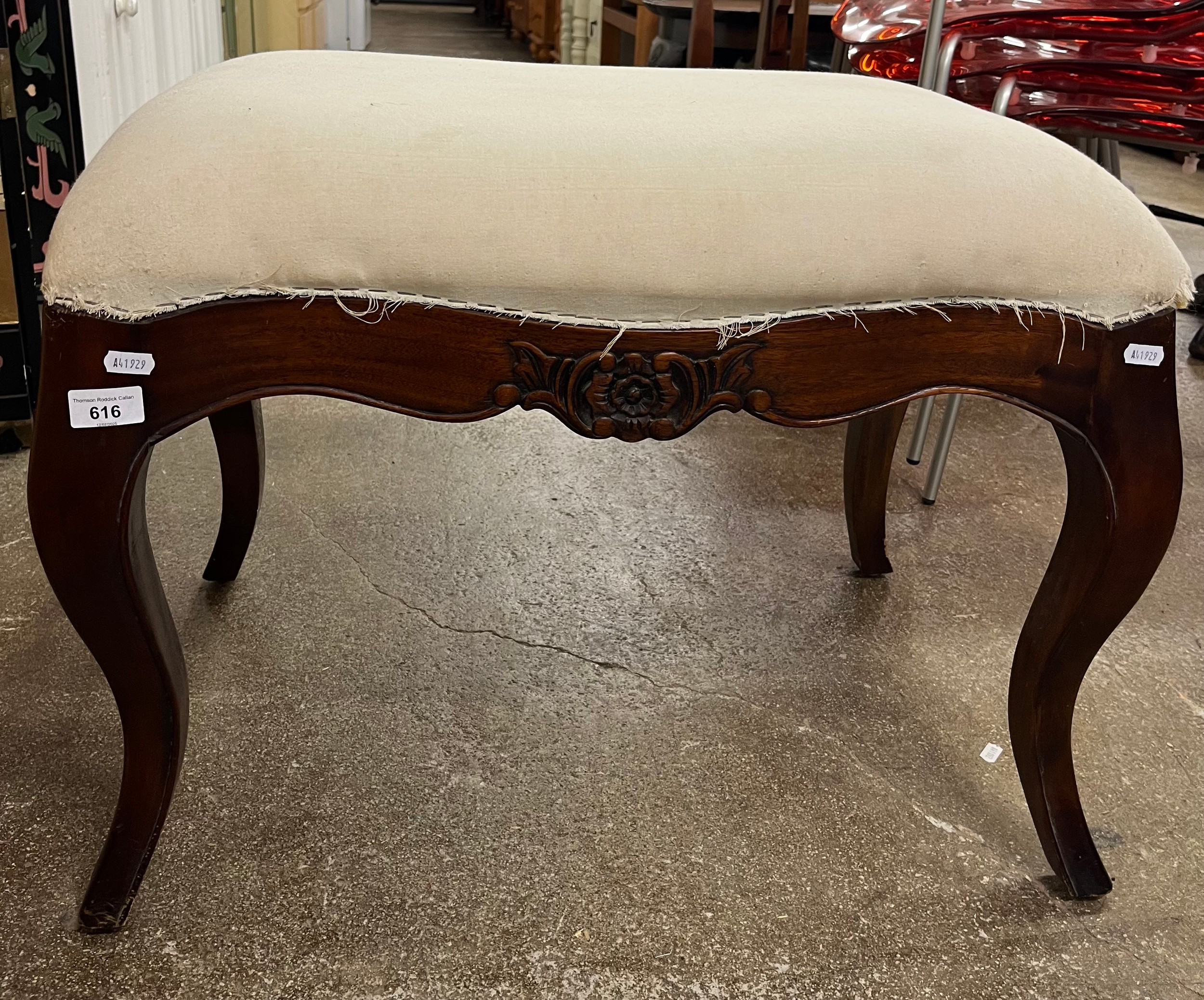 Mahogany rectangular upholstered stool on carved cabriole supports.