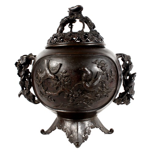 Oriental bronze censer, decorated with birds and branches, fitted lid decorated with leaves, berries and rat. 31cm tall.