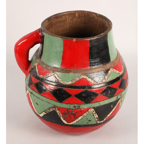 47 - Earthenware jug with colourful geometric design, 25cm h.