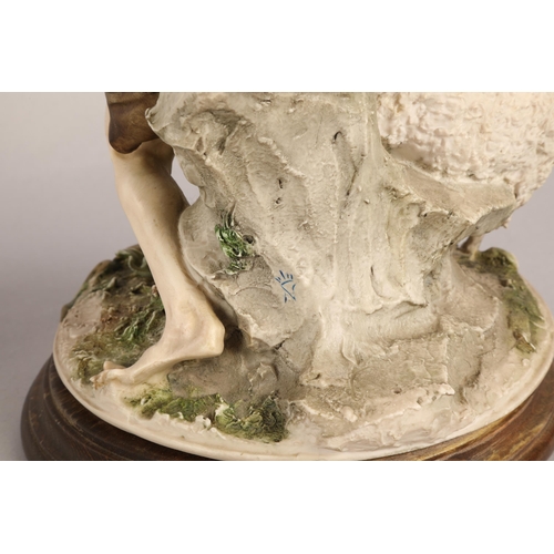 28 - Two large Capodimonte figures of a shepherd and shepherdess on wooden bases (2)