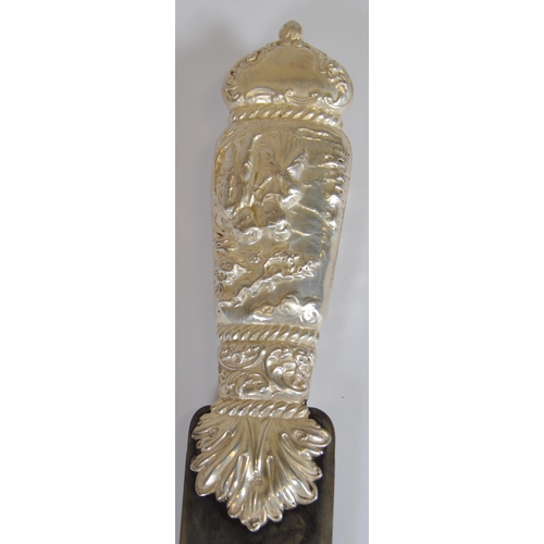 7 - Silver and tortoiseshell page turner, the handle embossed with a Dutch-style subject, Charles and Ri... 