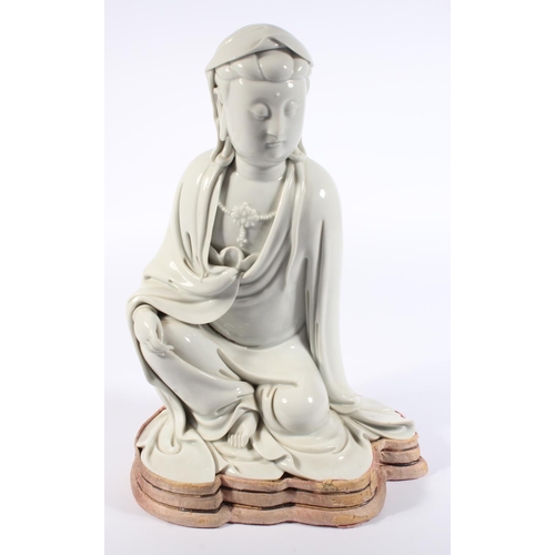 491 - Chinese blanc de chine porcelain figure of Guanyin, modelled in a seated position, 30cm tall, with o... 