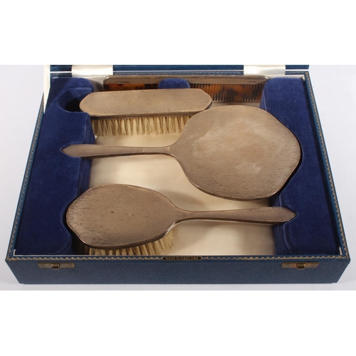 200T - Silver backed four piece dressing table set by Henry Clifford Davis, Birmingham 1962 and another mar... 