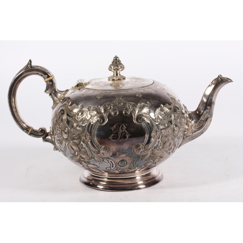 200U - Victorian silver four piece tea service of bullet and pear shape decorated in the Rococo manner with... 