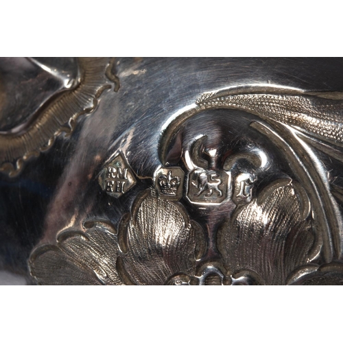 200U - Victorian silver four piece tea service of bullet and pear shape decorated in the Rococo manner with... 