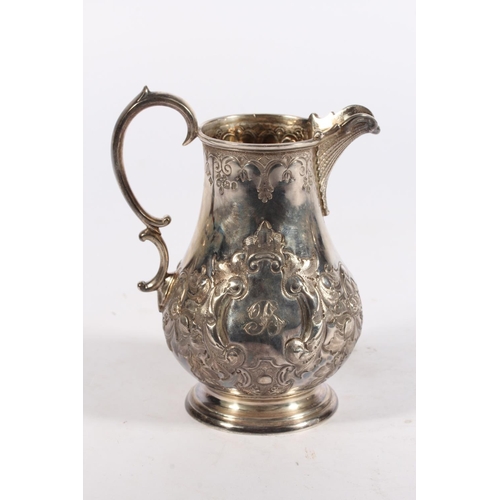 200U - Victorian silver four piece tea service of bullet and pear shape decorated in the Rococo manner with... 