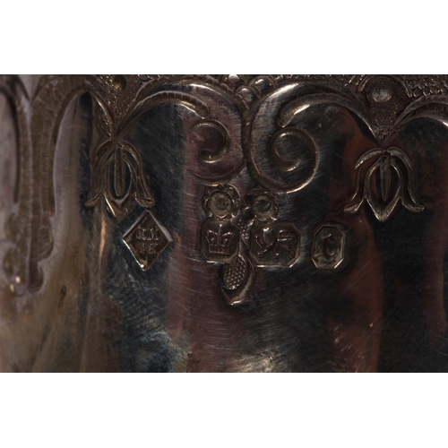 200U - Victorian silver four piece tea service of bullet and pear shape decorated in the Rococo manner with... 