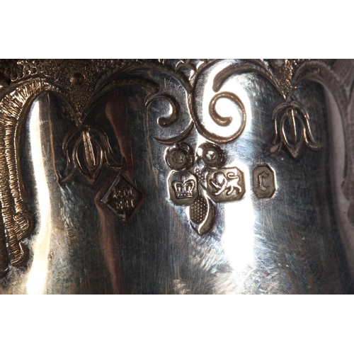 200U - Victorian silver four piece tea service of bullet and pear shape decorated in the Rococo manner with... 