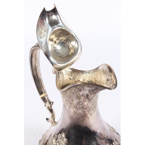 200U - Victorian silver four piece tea service of bullet and pear shape decorated in the Rococo manner with... 