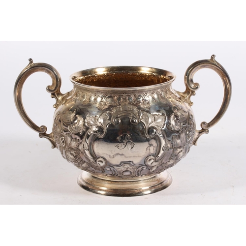 200U - Victorian silver four piece tea service of bullet and pear shape decorated in the Rococo manner with... 