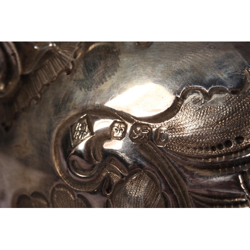 200U - Victorian silver four piece tea service of bullet and pear shape decorated in the Rococo manner with... 