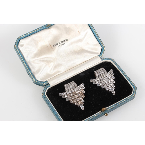 259 - Good pair of diamond set Art Deco clip brooches set in white metal, the central rows of diamonds sur... 