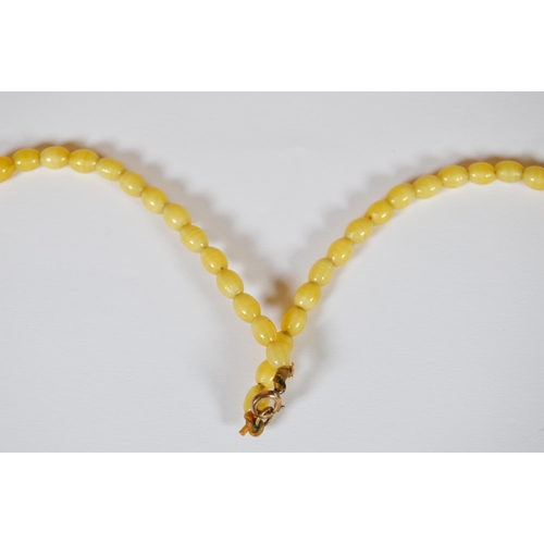 65 - String of Baltic translucent amber beads, c. early 20th century, comprising sixty-two graduated oval... 