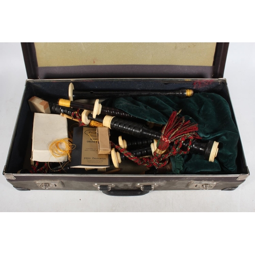 1895 - Set of Scottish bagpipes with ivory knops, the chanter stamped 'R G LAWRIE .... REGAL', in hinge top... 