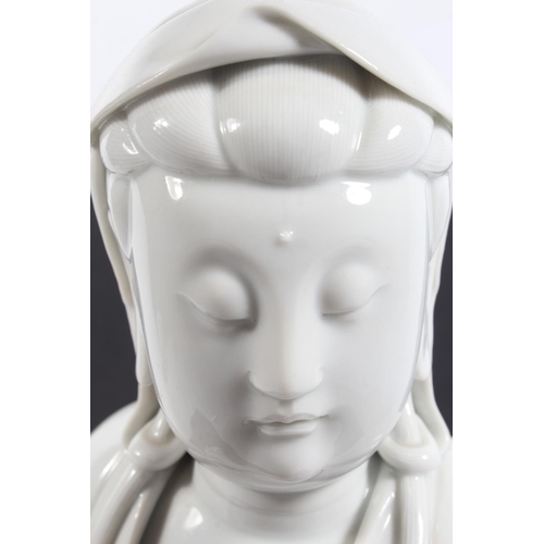 491 - Chinese blanc de chine porcelain figure of Guanyin, modelled in a seated position, 30cm tall, with o... 
