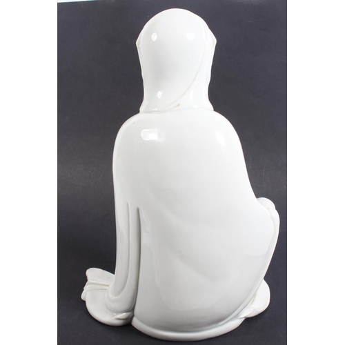 491 - Chinese blanc de chine porcelain figure of Guanyin, modelled in a seated position, 30cm tall, with o... 