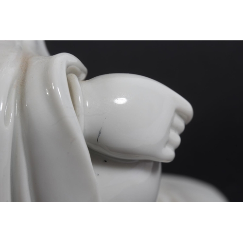 491 - Chinese blanc de chine porcelain figure of Guanyin, modelled in a seated position, 30cm tall, with o... 