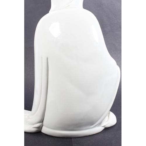 491 - Chinese blanc de chine porcelain figure of Guanyin, modelled in a seated position, 30cm tall, with o... 